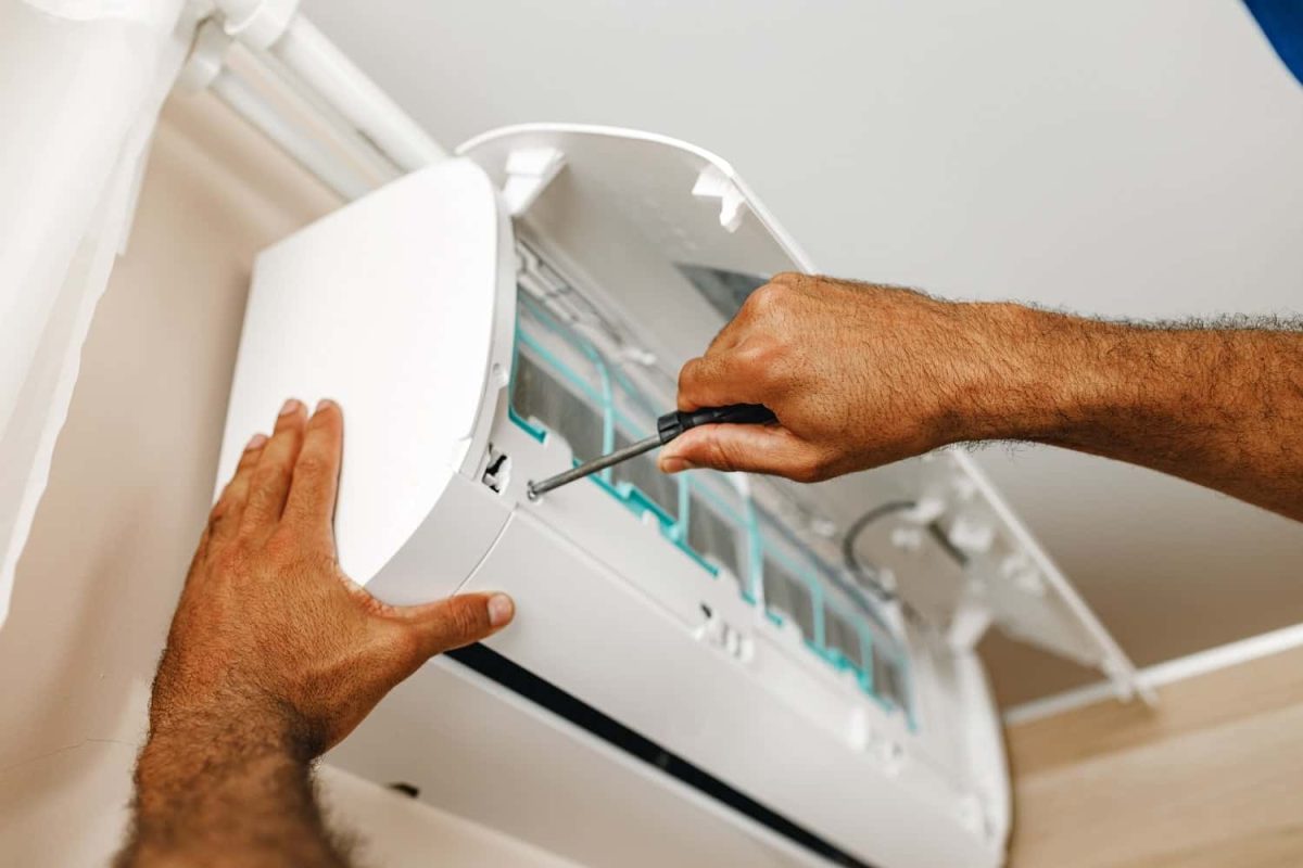 close-up-of-repairman-fixing-air-conditioner-in-a-2021-09-03-17-24-01-utc-min-min.jpg