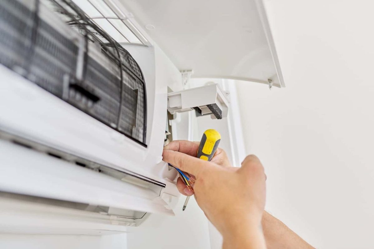 installing-an-air-conditioner-in-an-apartment-offi-2021-12-09-22-09-41-utc-min-min.jpg