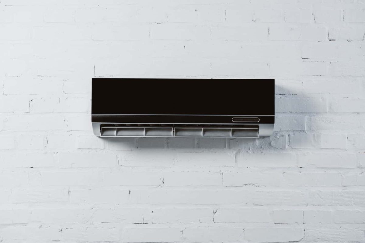 modern-air-conditioner-hanging-on-white-brick-wall-2021-09-08-21-59-40-utc-min-min.jpg